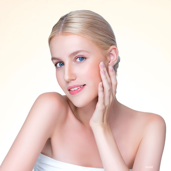 Blond woman with beautiful skin demonstrating natural aesthetic treatments at Chicago Iteld Asethetics Instittute